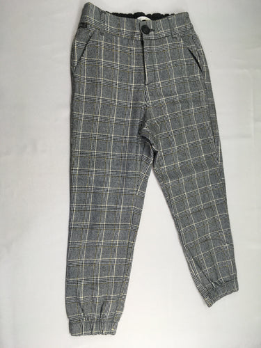 Pantalon style tweed à carreaux blanc/noir/doré, moins cher chez Petit Kiwi