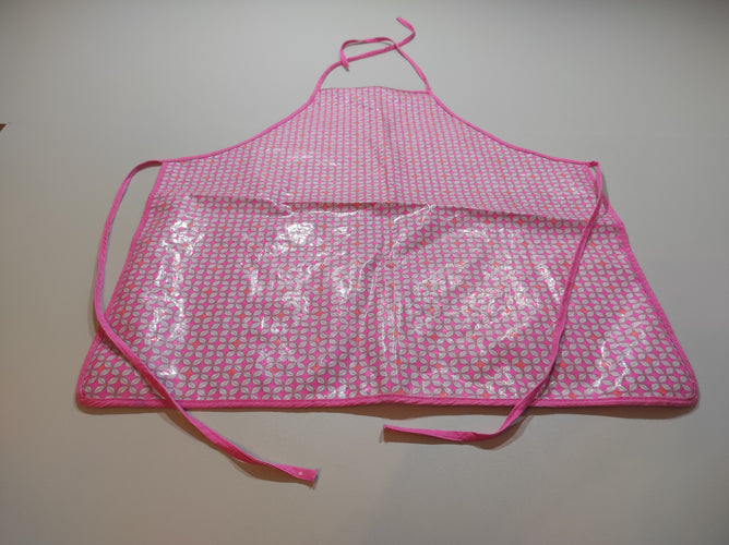 Tablier rose en plastiques, motif blancs, moins cher chez Petit Kiwi