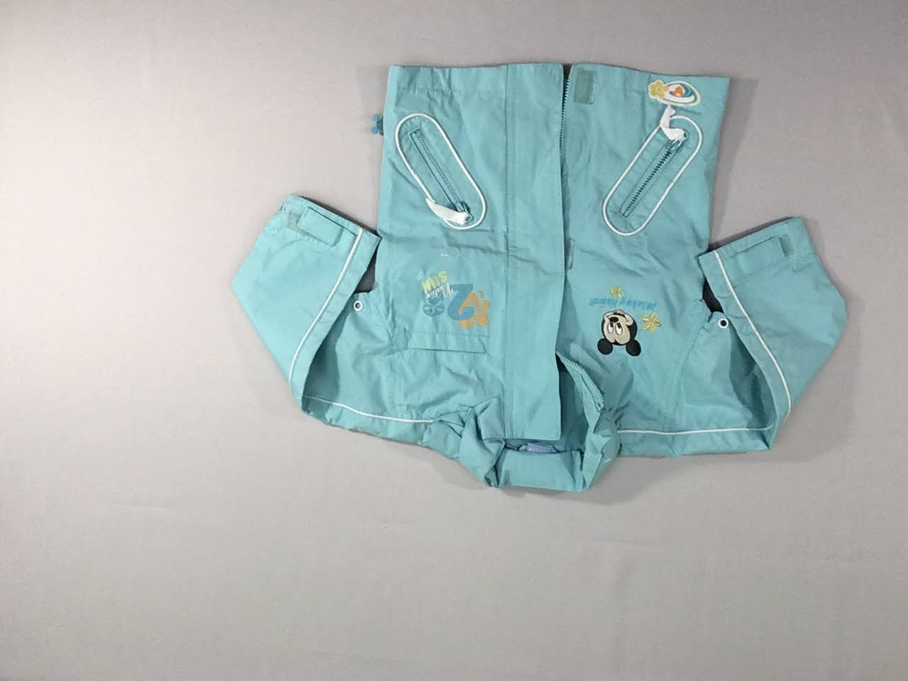 Veste coupe-vent bleu à capuche repliable dans la nuque Mickey