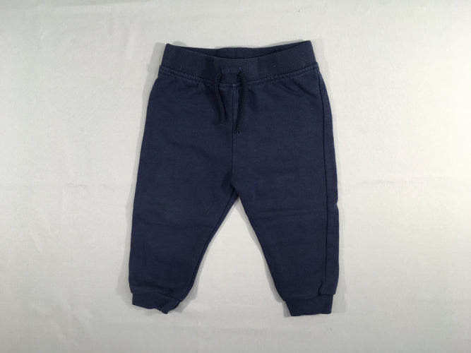 Pantalon molleton bleu marine, légèrement bouloché, moins cher chez Petit Kiwi